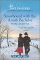 Snowbound with the Amish bachelor Cover Image